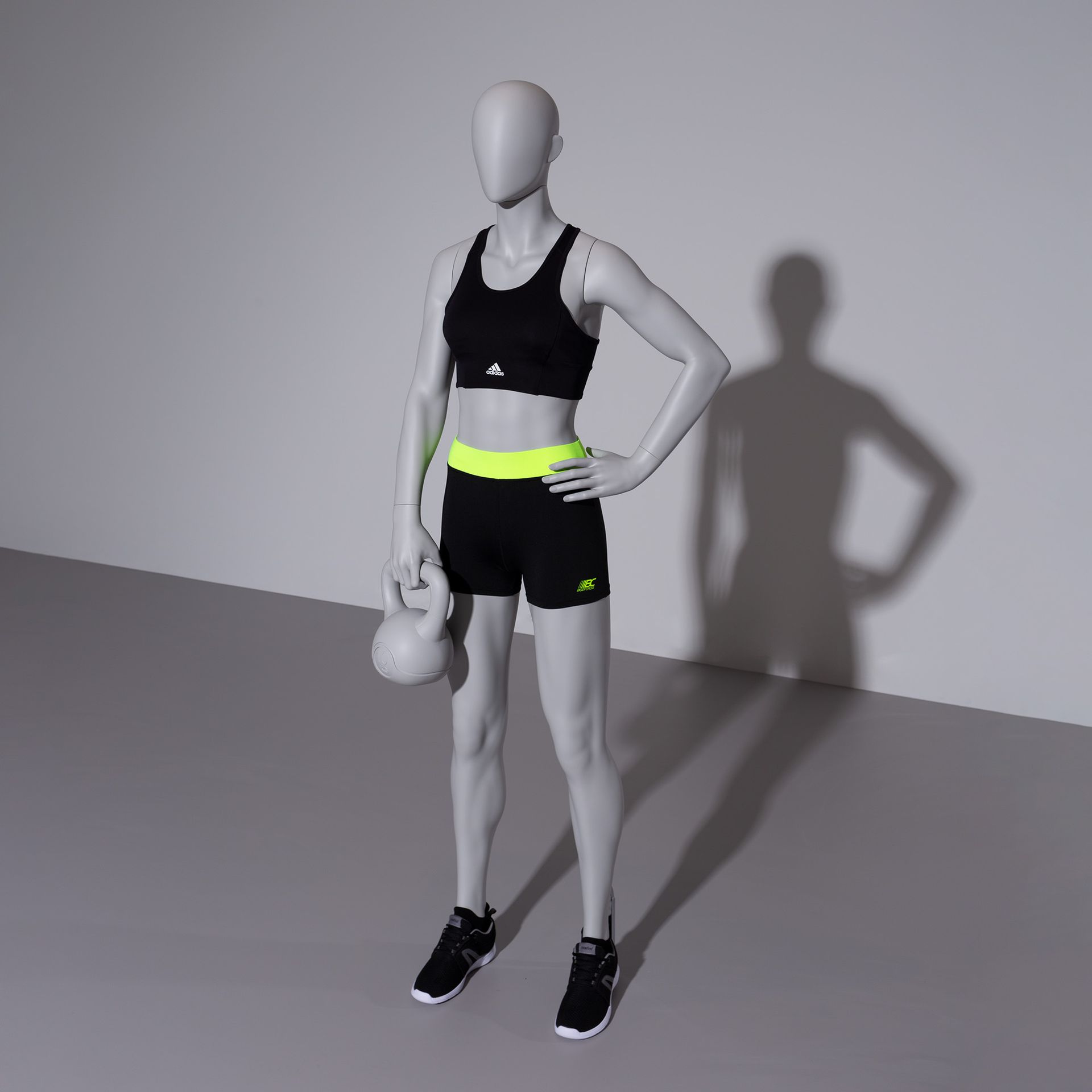 BINK - Kettlebell fitness mannequin, female, grey, abstract head, standing pose 11