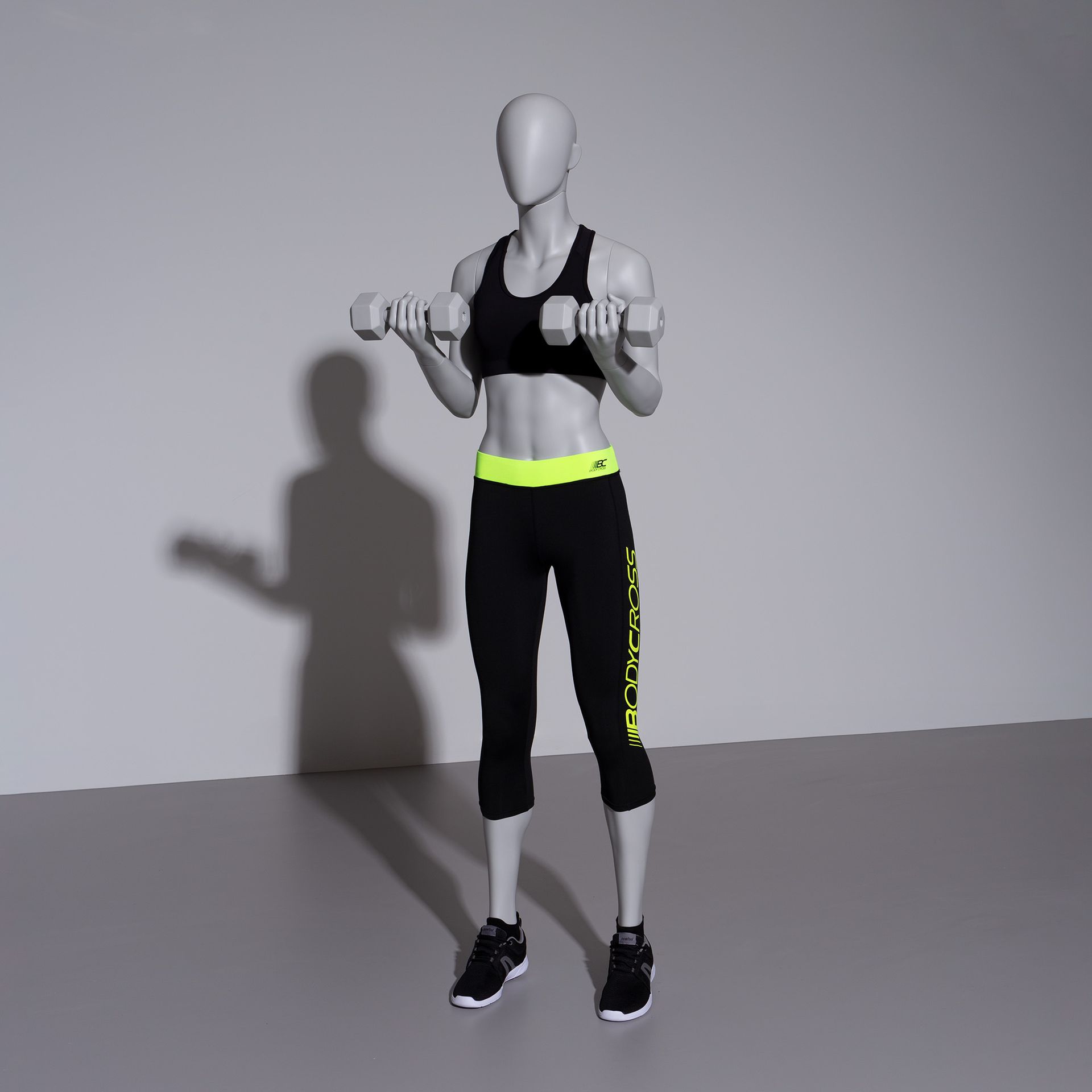 Kettlebel fitness mannequin, female, grey, abstract head, standing pose 12