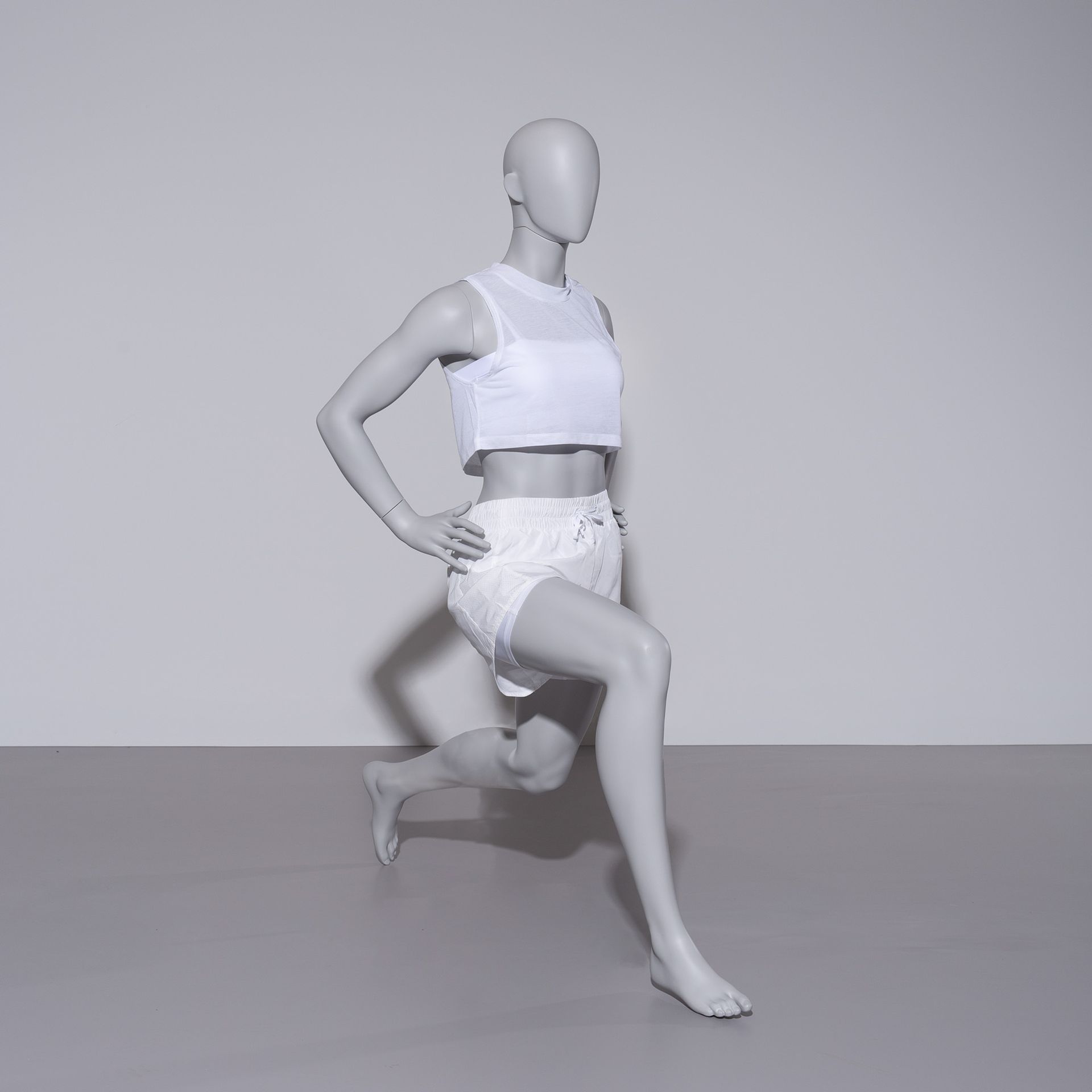BINK - Stretching sport mannequin, female, grey, abstract head, standing pose 06